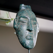 Maori Mask on Stand Green patinated